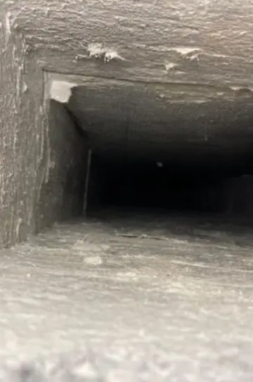 Looking down a dusty rectangular duct run